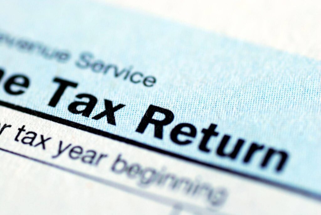 A tax return form displaying sections for income deductions and personal information for filing taxes
