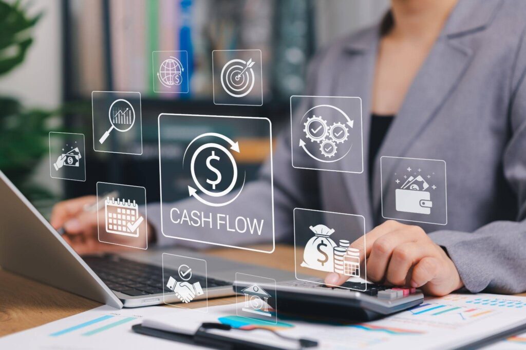 Laptop screen displaying a cash flow diagram with graphs and financial data for analysis