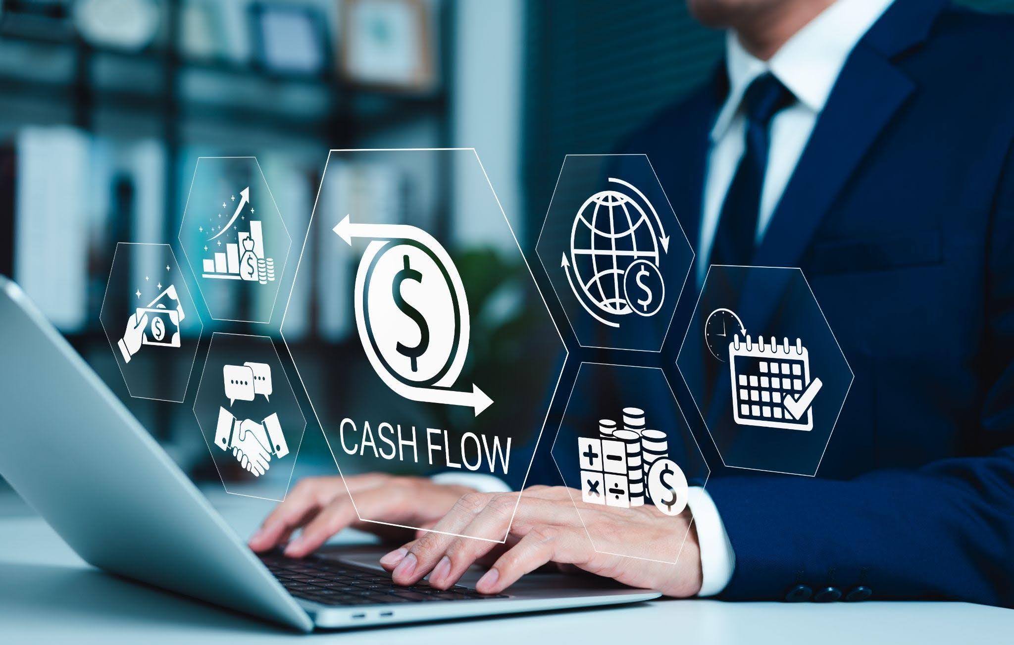 Laptop screen featuring a cash flow statement with visual representations of financial trends and metrics